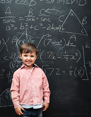 Buy stock photo Smart, kid and math on chalkboard for school, learning and education with happy portrait and confidence. Genius and clever child, boy or student with equation, numbers and test for IQ or intelligence