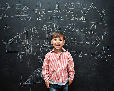 Buy stock photo Child, boy and face or excited by blackboard with letters, numbers and education in classroom at school. Kid, student and happy for knowledge, learning and chalkboard with math, drawing and preschool