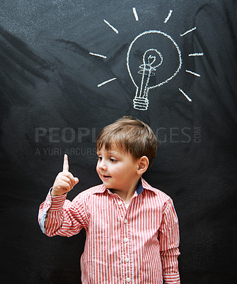 Buy stock photo Child, solution and lightbulb on chalkboard for ideas, learning and education in school with answer or questions. Happy kid, student or boy with light bulb, emoji and creative knowledge on blackboard