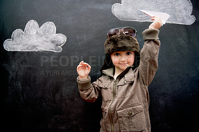 Buy stock photo Portrait, chalkboard and toy plane with boy in studio on black background for fantasy game. Children, education and kid pilot in costume playing at school for growth, learning or child development