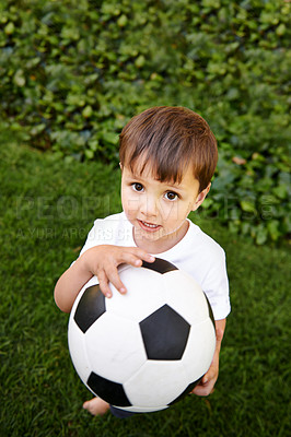 Buy stock photo Portrait, boy or play with soccer ball in park for fun, healthy or childhood development in Morocco. Happy, young and male child with football for afternoon game or exercise in backyard or garden