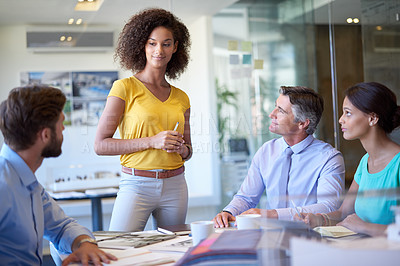 Buy stock photo Cropped shot of a group of businesspeople in a meeting