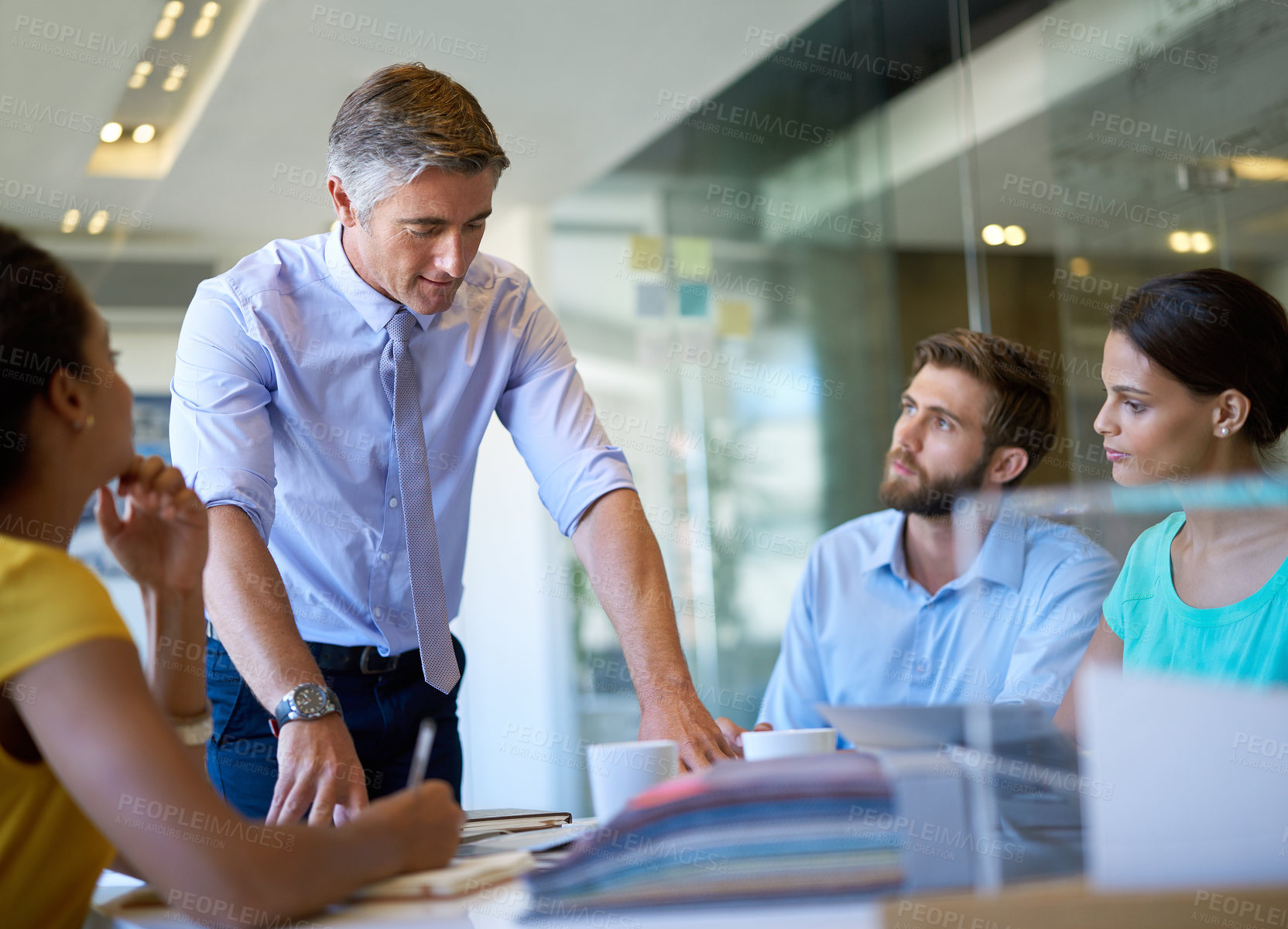 Buy stock photo Shot of a group of coworkers in a business meeting