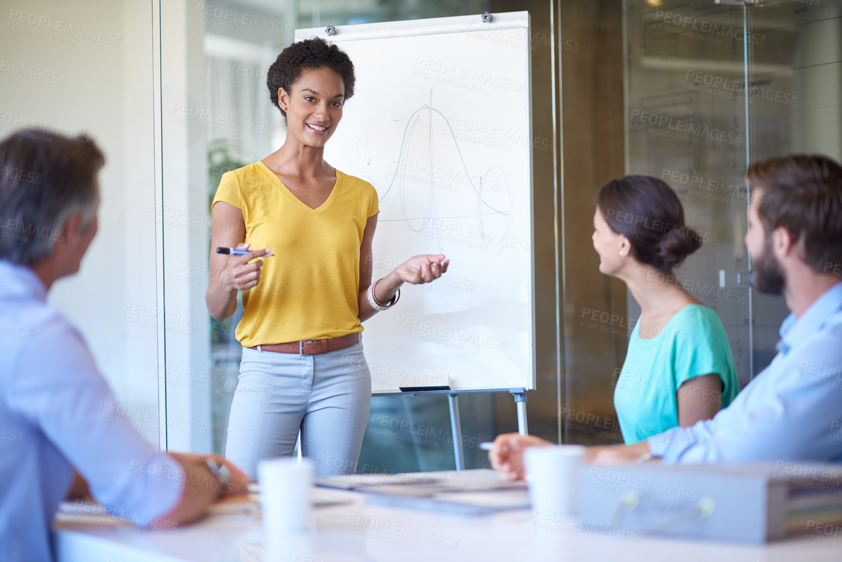 Buy stock photo Cropped shot of an attractive young woman giving a business presentation