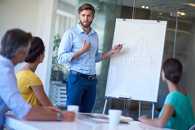 Buy stock photo Cropped shot of a handsome young man giving a business presentation