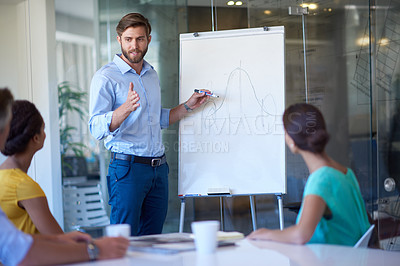 Buy stock photo Cropped shot of a handsome young man giving a business presentation