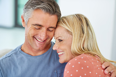 Buy stock photo Shot of a mature couple being affectionate at home