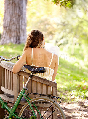 Buy stock photo Bicycle, bench or woman in park to relax for wellness, nature or health on holiday vacation in autumn. Amsterdam, back or female person resting on break alone with bike for eco friendly transport