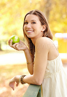 Buy stock photo Apple, park and portrait of woman with wellness in nature eating fruit for health with smile and happiness on farm. Relax, happy and young person on diet for nutrition and organic agriculture