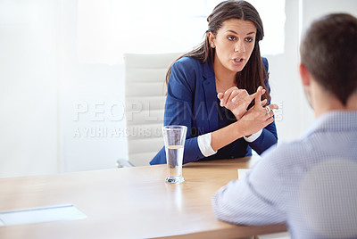Buy stock photo Cropped shot of a young businesswoman having a one-on-one meeting with an employee