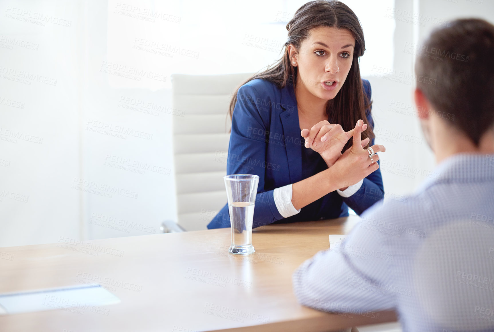Buy stock photo Cropped shot of a young businesswoman having a one-on-one meeting with an employee