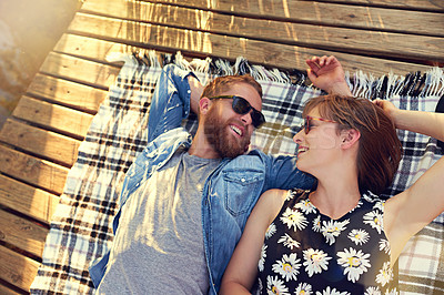 Buy stock photo Relationship, couple and happy with lying on ground on break with love, rest and affection for care. Above, outdoor and smile on wood on blanket on valentines day for holiday to relax and bonding