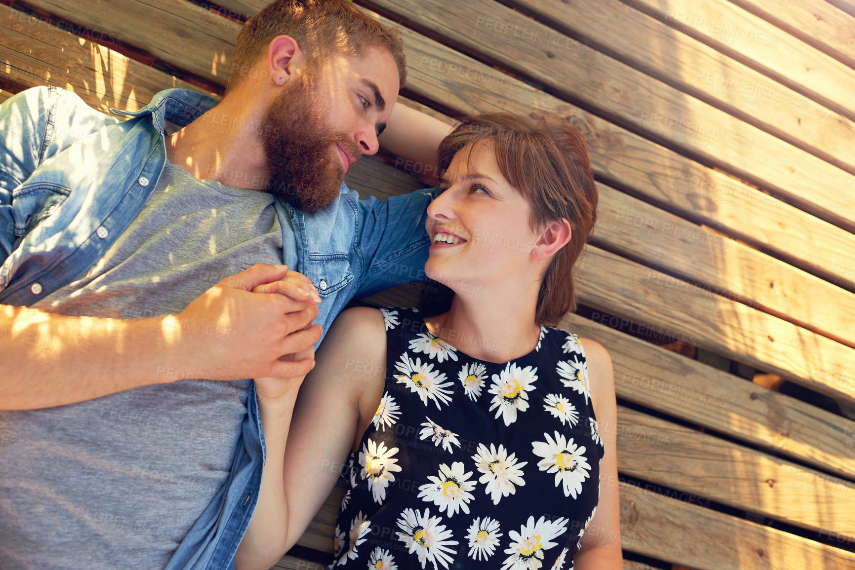 Buy stock photo Above, happy couple and relax in park with love, summer date or chill for anniversary or holiday. Woman, man and holding hands for vacation, healthy relationship or commitment with trust or care