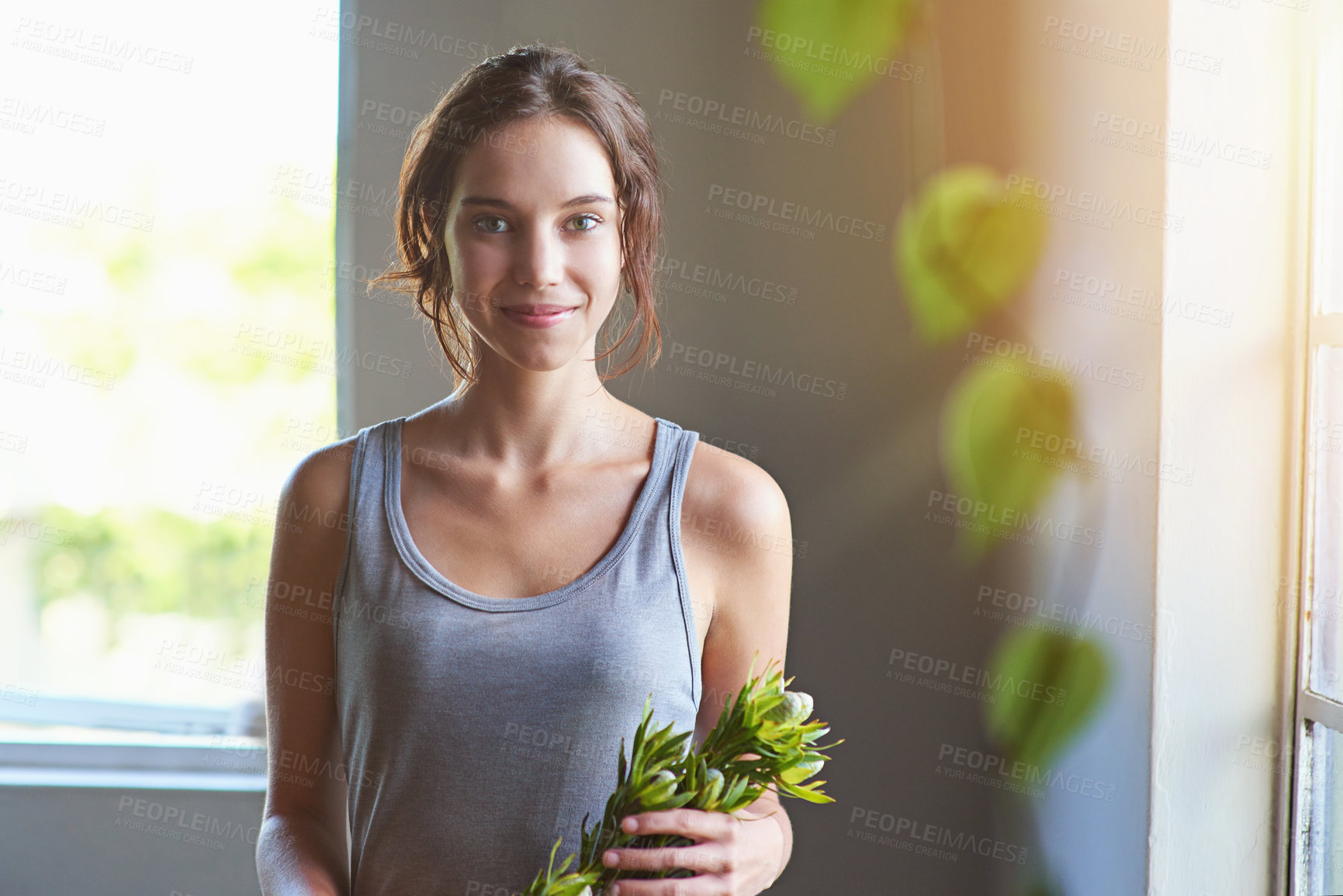 Buy stock photo Flower, arrangement and portrait of woman in home with smile, indoor gardening and floral creativity. Happy, plants and hobby florist in apartment with green bouquet for eco friendly decoration.