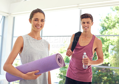 Buy stock photo Portrait of a young couple working out indoors
