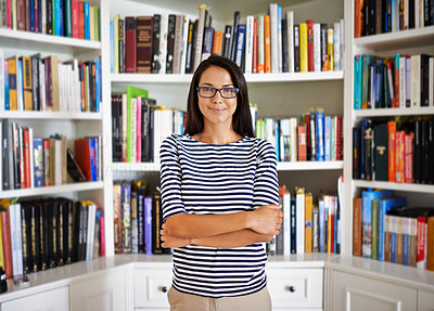 Buy stock photo Woman, portrait and confidence by bookshelf in home with books for reading, learning and knowledge in living room. Professor, face or happy by house library with magazine, journal or study collection