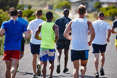 Buy stock photo A group of men running a marathon