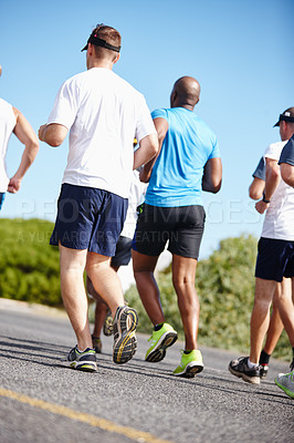 Buy stock photo A group of men running a marathon