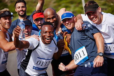 Buy stock photo Portrait of a group of excited young men standing together after running a marathon