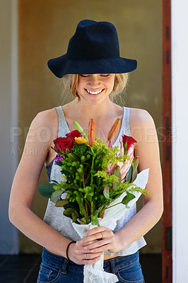 Buy stock photo A young woman holding a bunch of flowers
