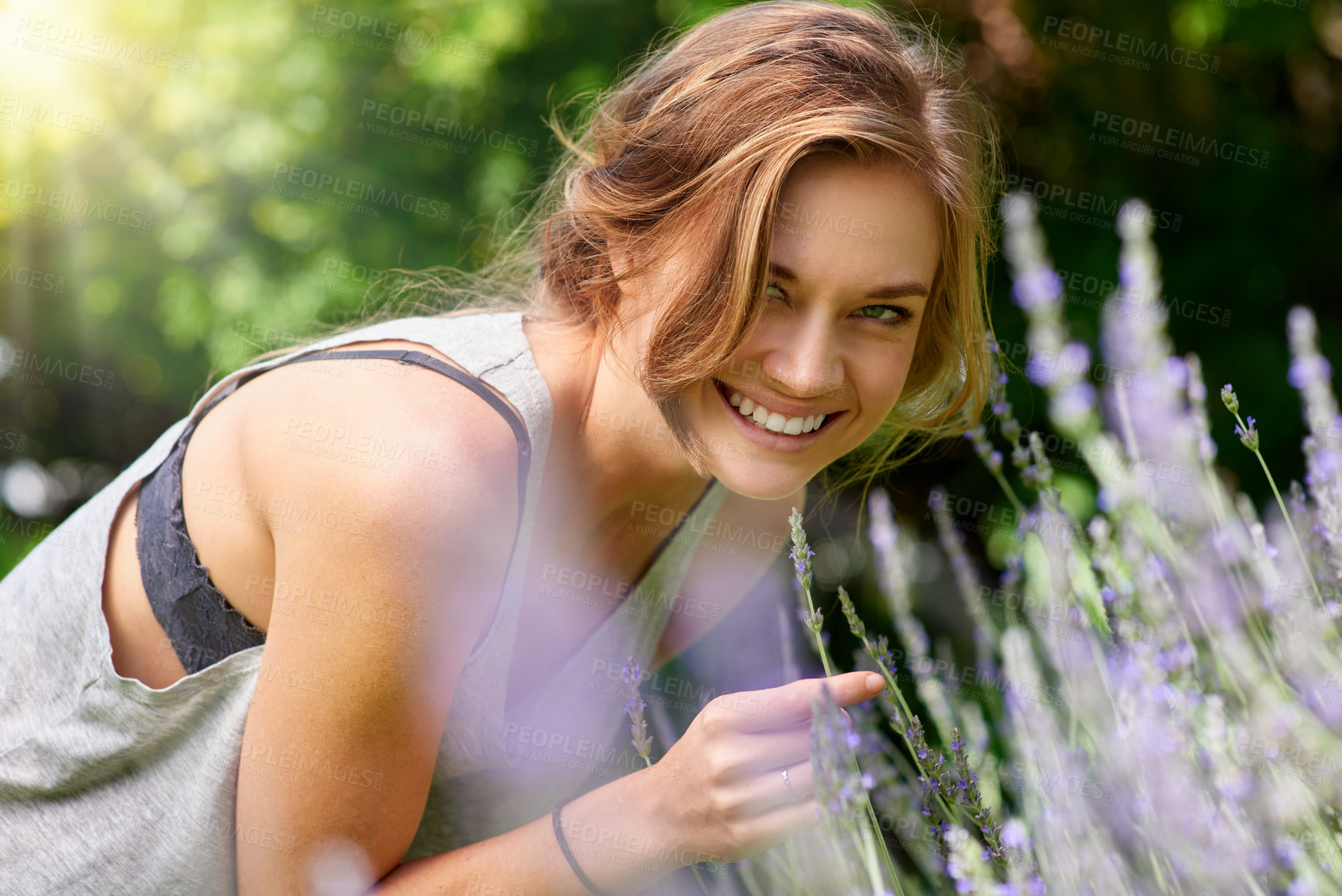 Buy stock photo Woman, portrait and flowers in garden with lavender farm outdoor with herbs for herbal aromatherapy. Happy, smile and nature with floral, plants and agriculture with female person on spring break