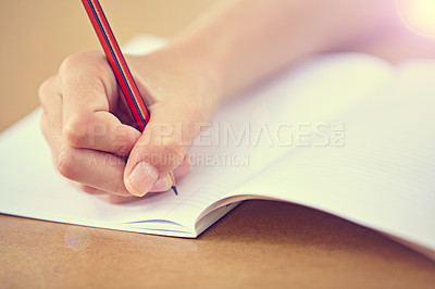 Buy stock photo Writing, notebook and hand of child on desk in school with pencil, notes or learning for education. Paper, closeup and student start to study on table in class with knowledge or information in lesson