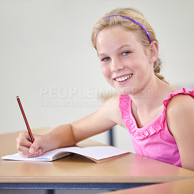 Buy stock photo Portrait, child and education of student taking notes in classroom for knowledge, development and happy. Smile, girl and learner writing in notebook, studying or learning in middle school in Canada.