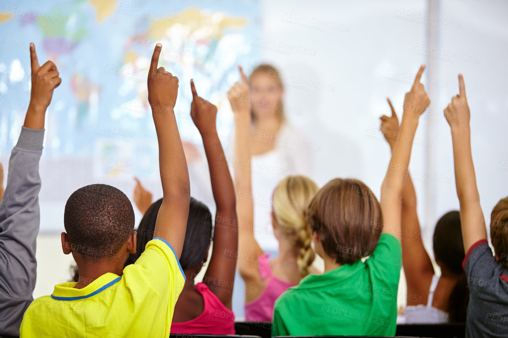 Buy stock photo Back of students, classroom and raise hands for questions, education or learning with geography quiz in school. Youth, group or smart kids with teaching for support, class ideas and answer or advice