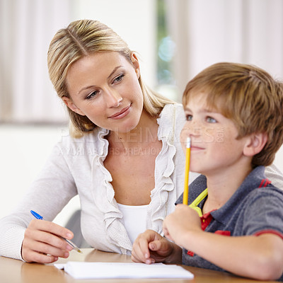 Buy stock photo Teacher, student and helping with school work in class, question and think of answer for education and knowledge. Teaching, learn and woman with boy in classroom, study and problem solving for test