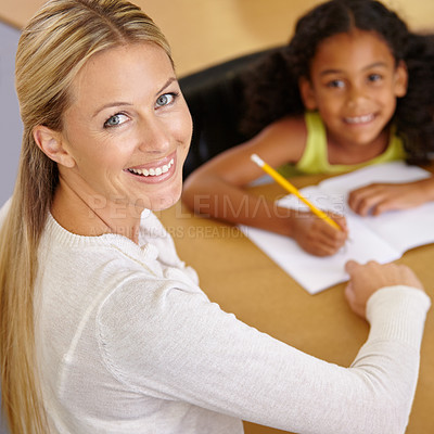 Buy stock photo Private tutor, portrait and child to learn in class at desk at school for an education with support. Woman, teaching and writing student with smile for learning or reading in the classroom for study.