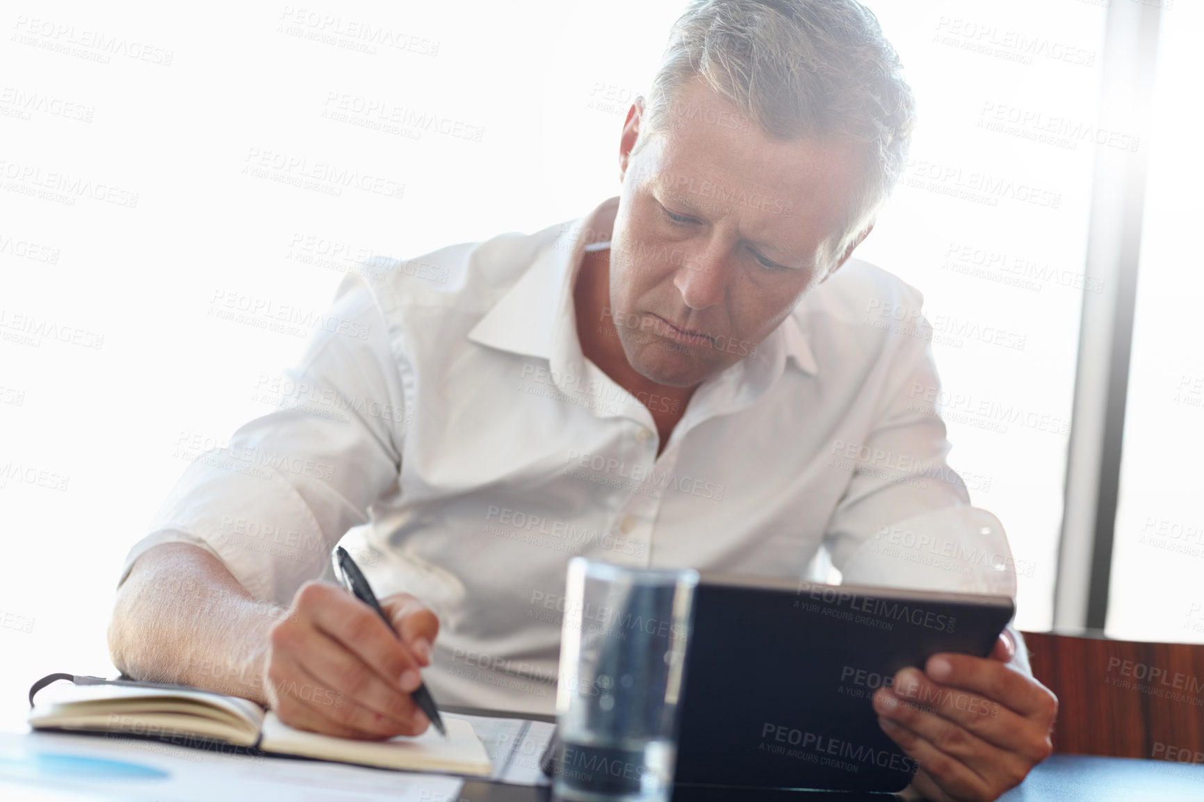 Buy stock photo Cropped shot of a handsome businessman in the office