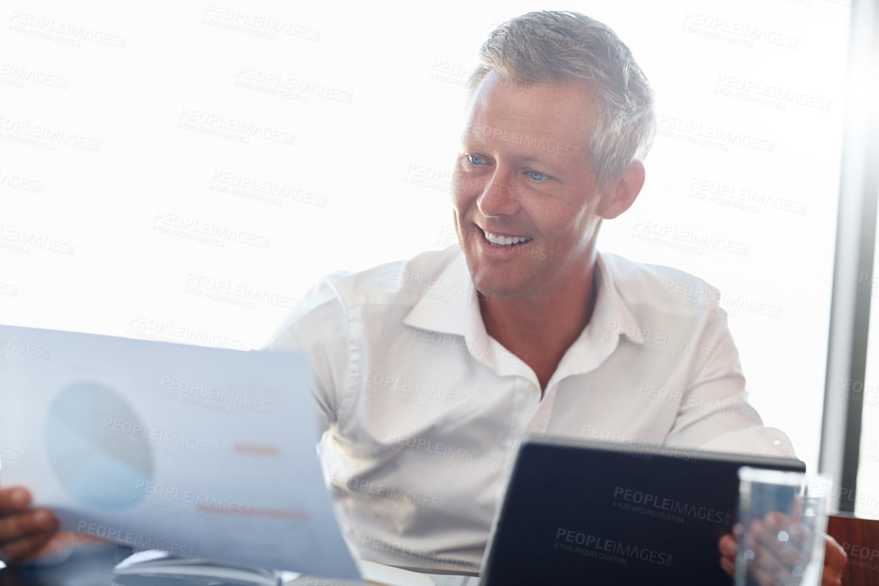 Buy stock photo Cropped shot of a handsome businessman in the office