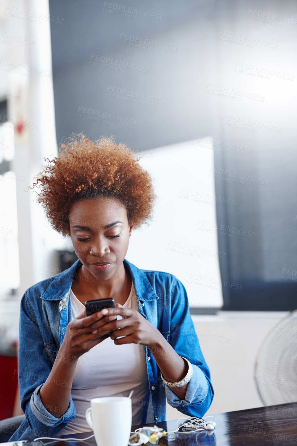 Buy stock photo Shot of a beautiful young woman using a mobile phone in a casual office