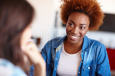 Buy stock photo Shot of two colleagues having a discussion in the office