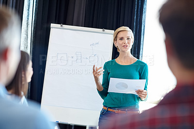 Buy stock photo Shot of an attractive woman doing a presentation for her colleagues