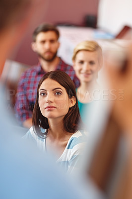 Buy stock photo Shot of a group of coworkers listening to a presentation