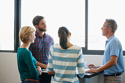 Buy stock photo Shot of a group of colleagues having a brainstorming sesion