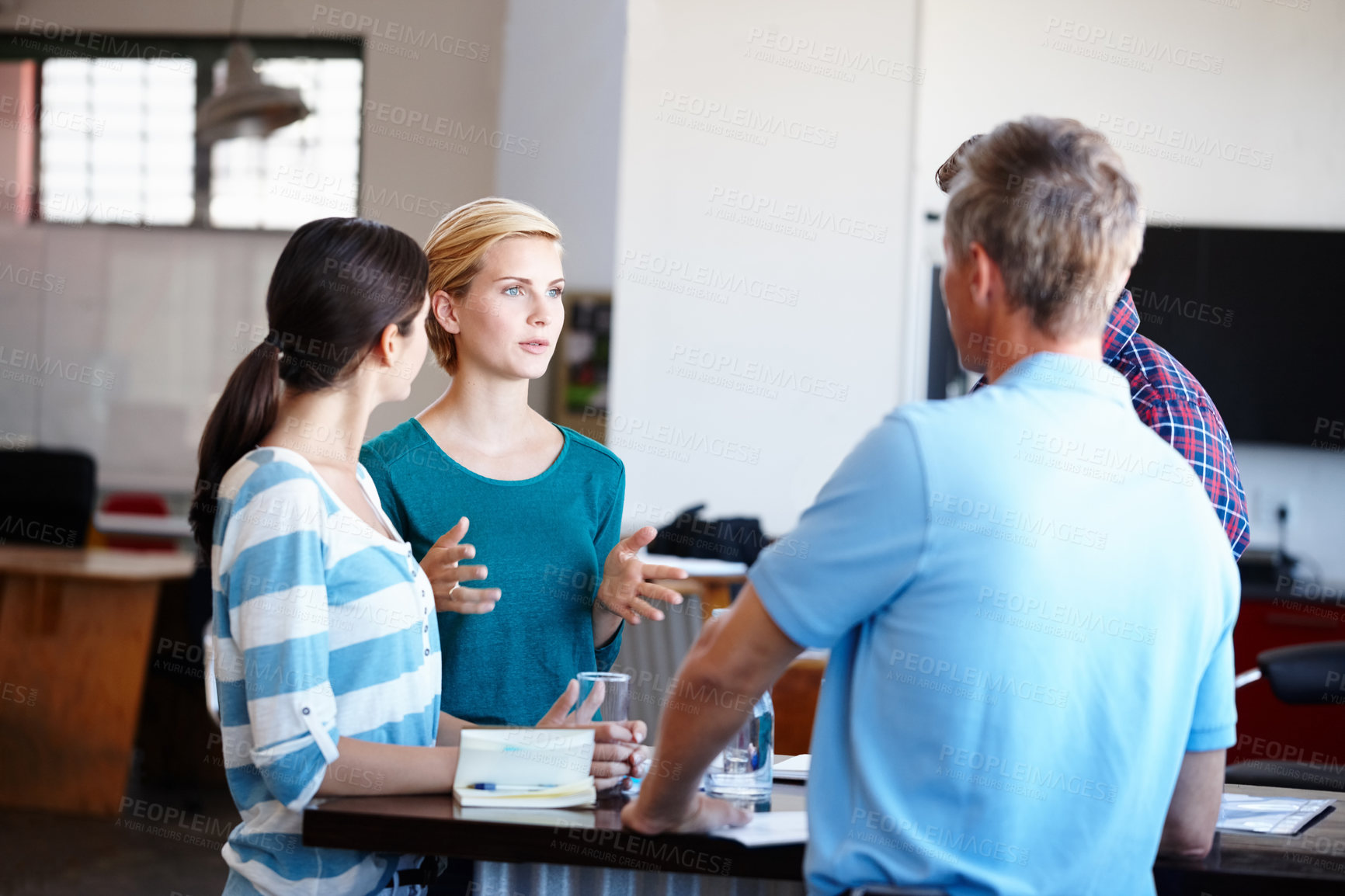 Buy stock photo Shot of a group of colleagues having a brainstorming sesion