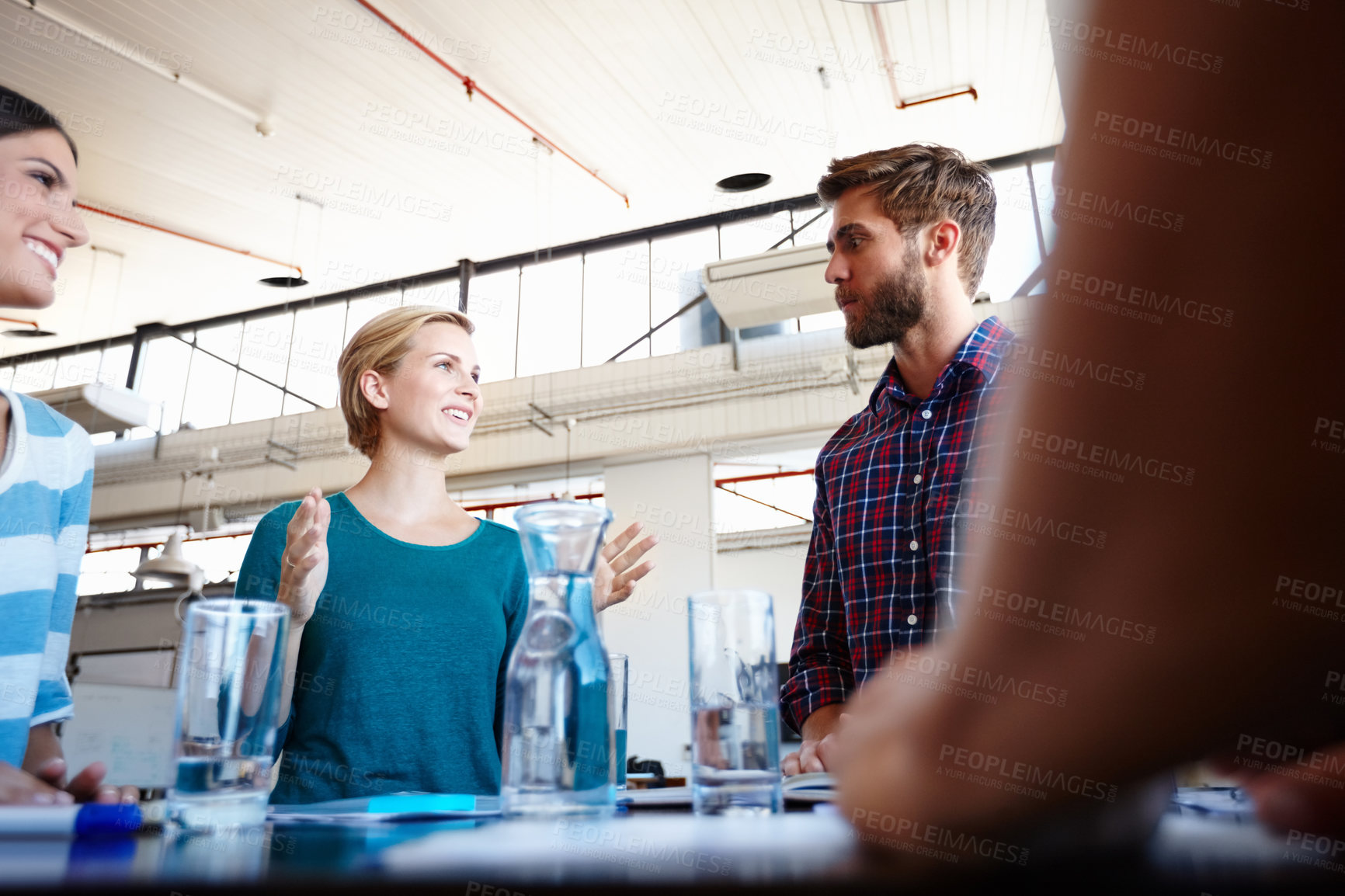 Buy stock photo Shot of a group of colleagues having a brainstorming sesion