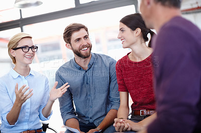 Buy stock photo Cropped shot of colleagues having a discussion in the office