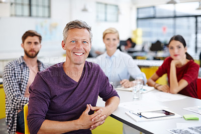 Buy stock photo Cropped shot of a group of coworkers in a meeting