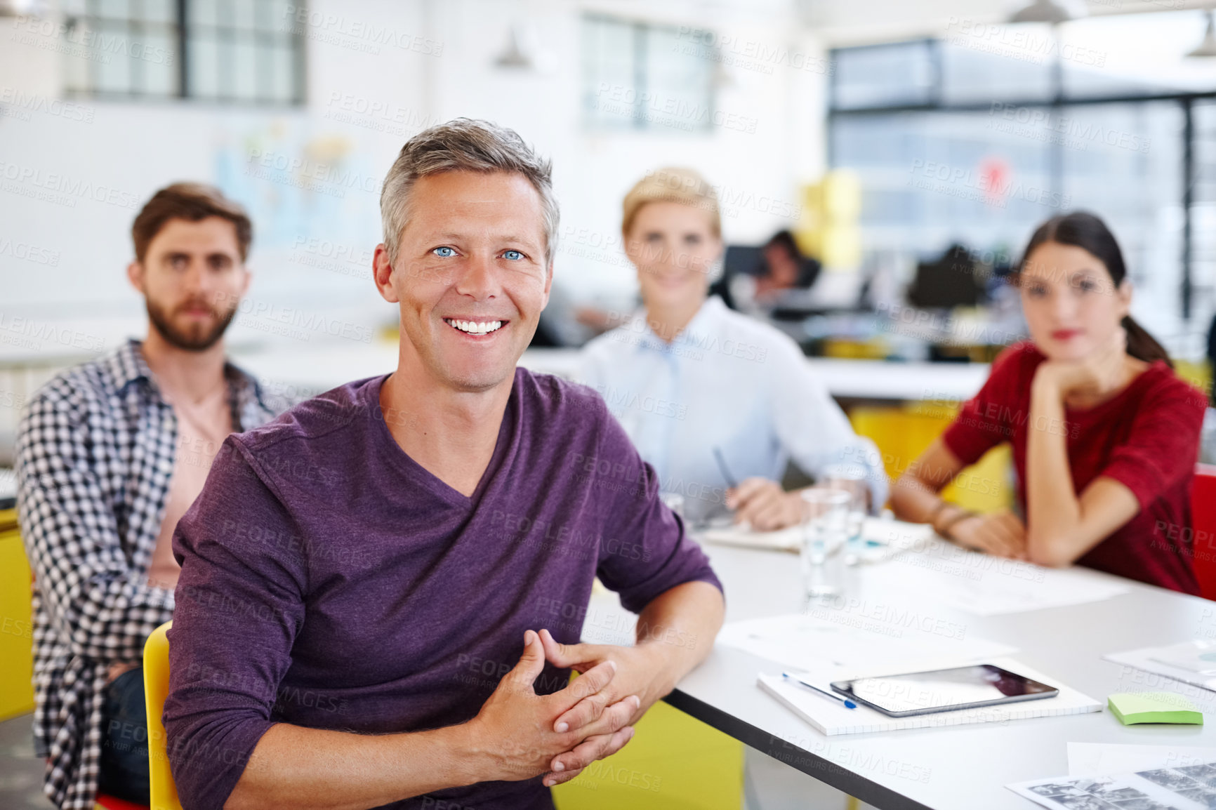 Buy stock photo Cropped shot of a group of coworkers in a meeting