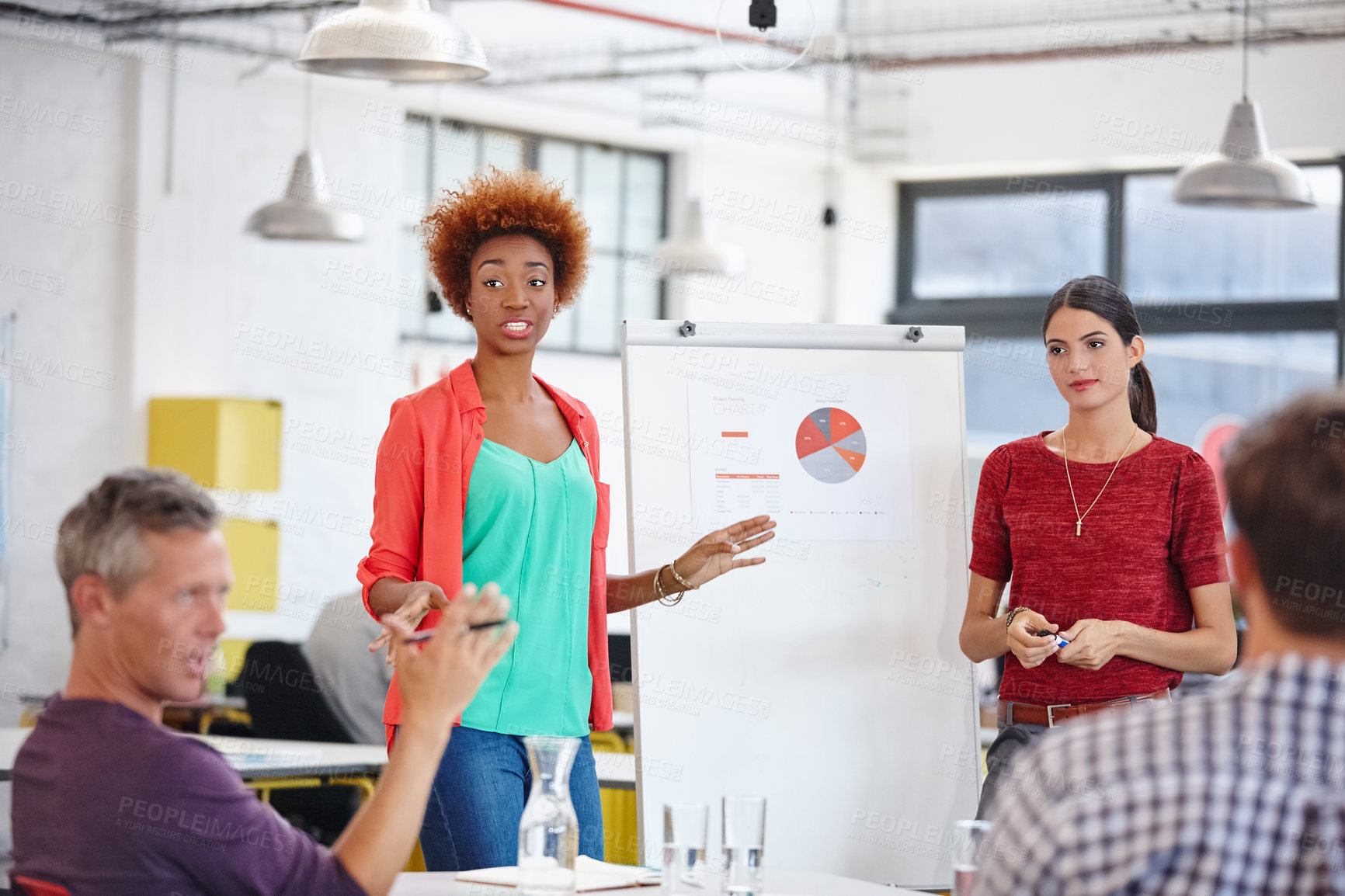 Buy stock photo Cropped shot of a group of coworkers in a meeting