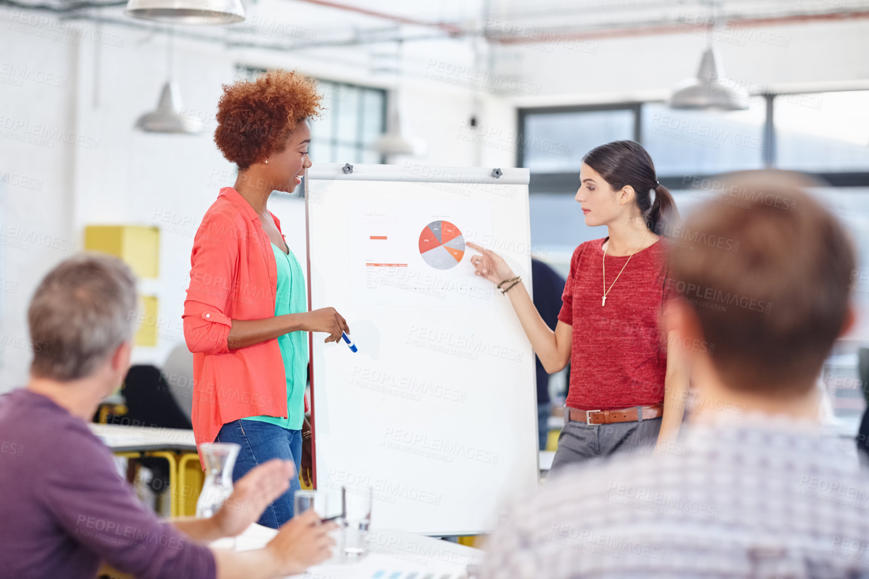 Buy stock photo Cropped shot of a group of coworkers in a meeting