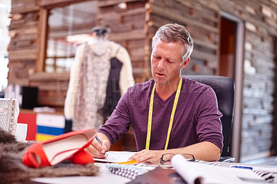 Buy stock photo Cropped shot of a handsome designer at work in his office