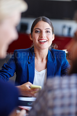 Buy stock photo Portrait of a young creative professional in a meeting with her coworkers