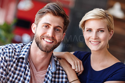 Buy stock photo Cropped portrait of two coworkers in an informal office setting