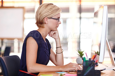 Buy stock photo Cropped profile an attractive young businesswoman working on her computer
