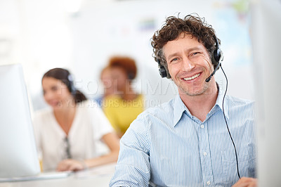 Buy stock photo Cropped portrait of a handsome call center operator in the office
