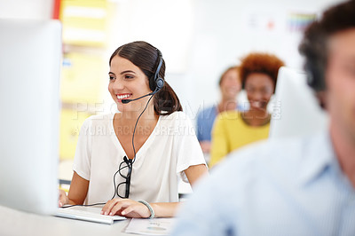 Buy stock photo Cropped shot of an attractive young call center operator in the office